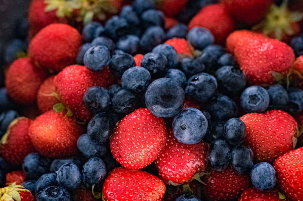 The Art of Drawing Readers In: Your attractive post title goes here Vibrant close-up of fresh strawberries and blueberries displaying natural texture and freshness.